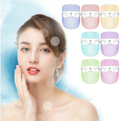 Woman with a clear face mask and colorful face mask options on a light blue background