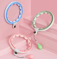 Three colorful pet collars on a pink background