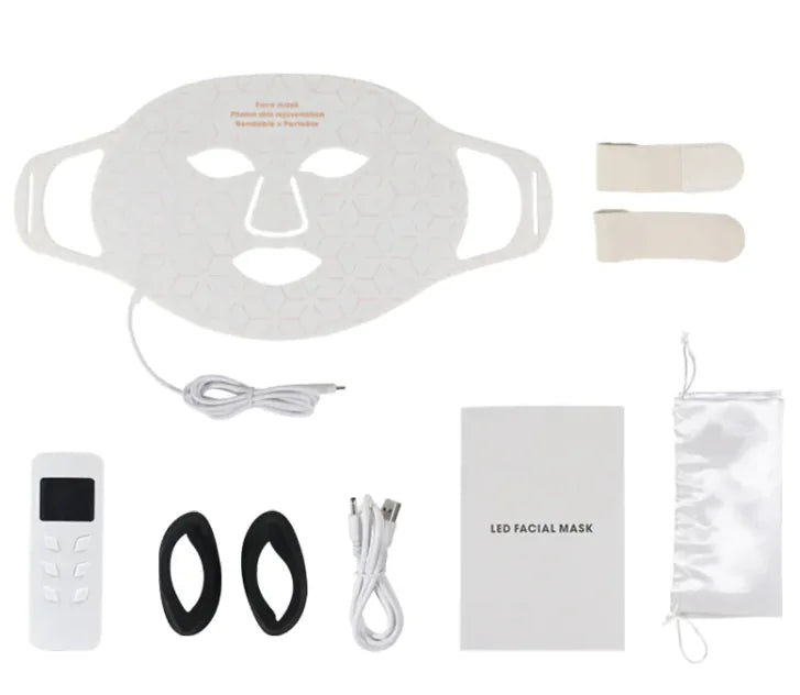 LED facial mask set with remote control, earbuds, and packaging on a white background