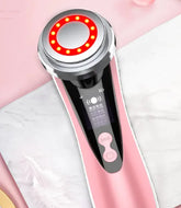 Beauty device with LED lights on a pink background