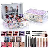 Makeup set with various products in a decorative case on a white background